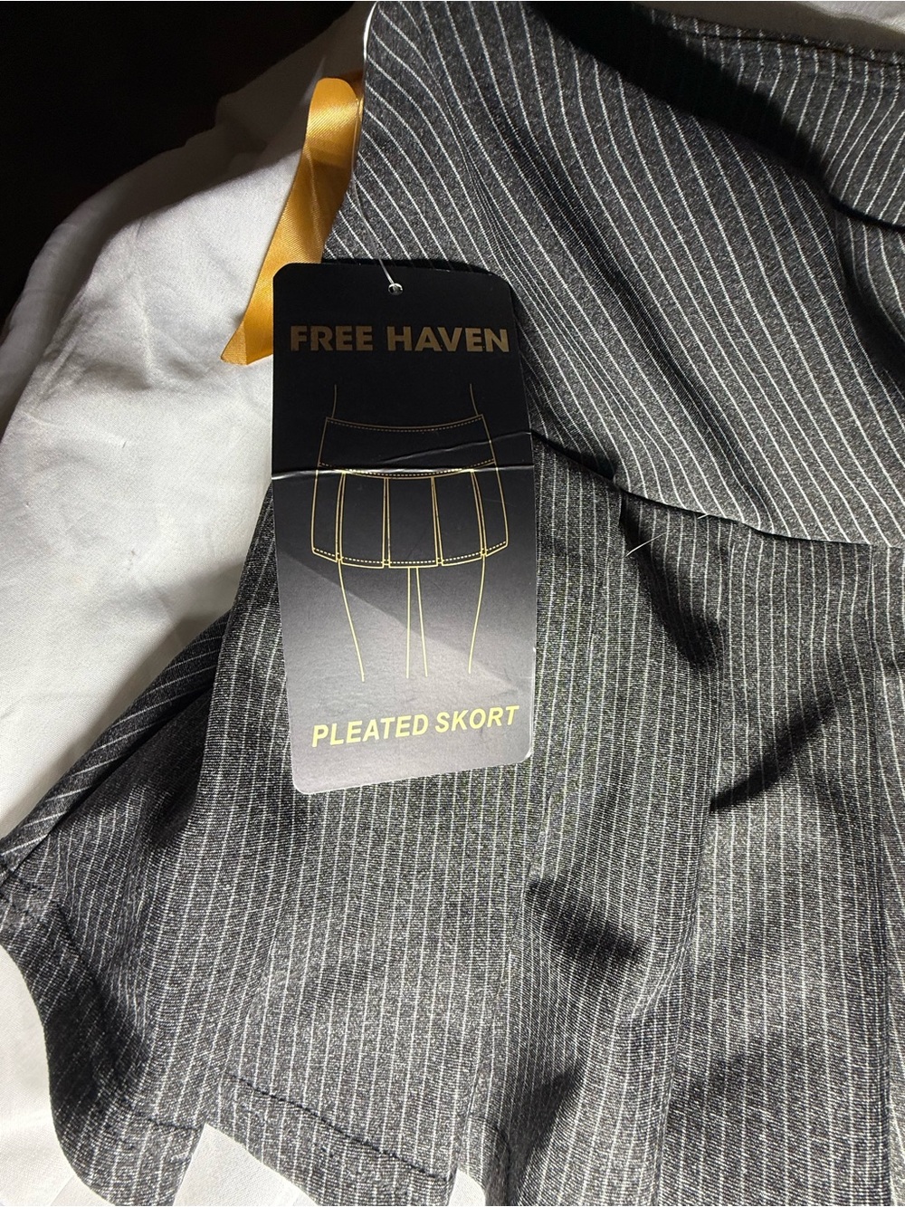 Free Haven Women's Pinstripe Pleated Mini Skort with black bow accents- Black- L - Picture 4 of 7